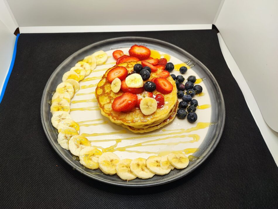 Pancakes with fruits and maple syrup